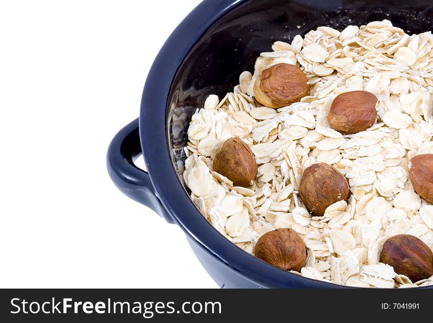 A bowl of oatmeal with hazelnuts - healthy diet