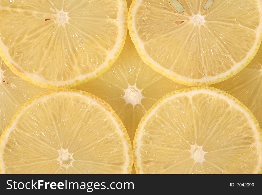 Slices of yellow lemon in macro view