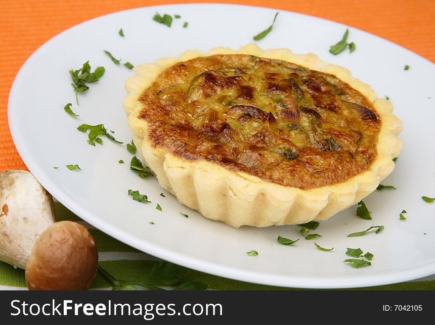 Small mushrooms boletus pies on plate