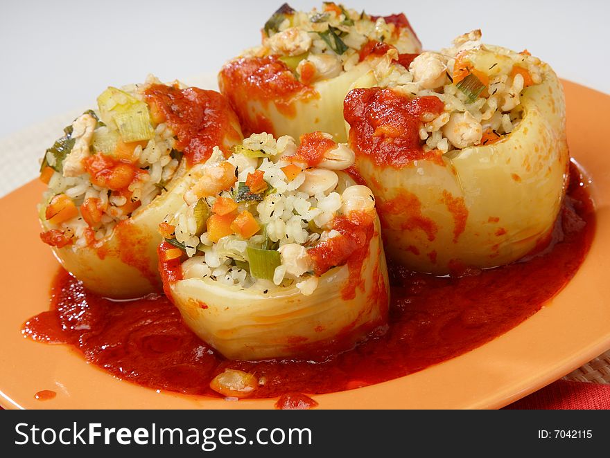 Filled yellow peppers with minced meat,rice and beans on plate