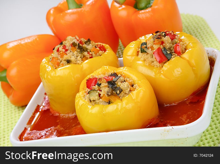 Filled yellow peppers with minced meat,rice and beans on plate