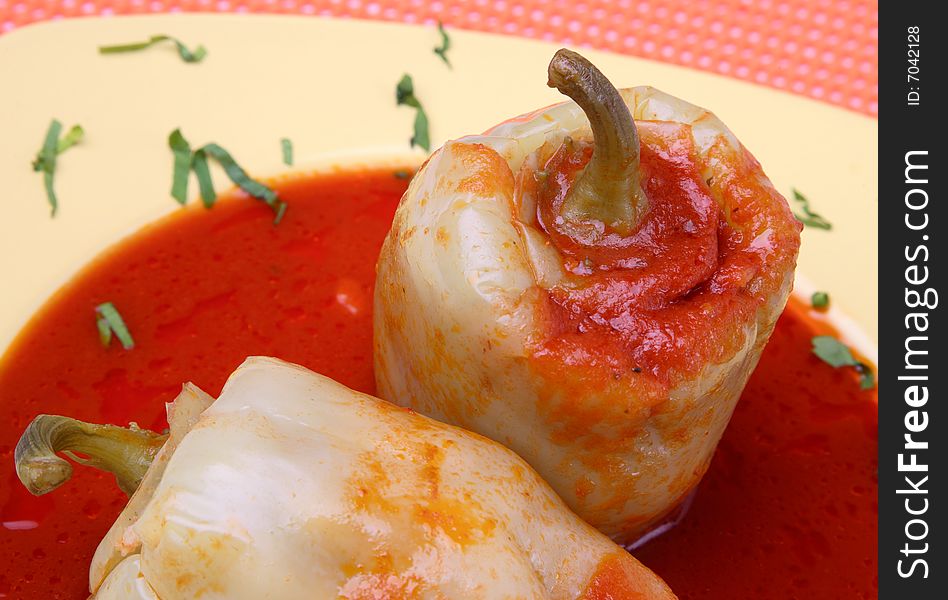 Filled yellow peppers with minced meat,rice and beans on plate