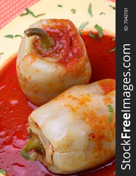 Filled yellow peppers with minced meat,rice and beans on plate