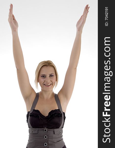 Smiling woman stretching her arms against white background