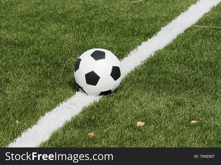 Football in stadium with an artificial covering before the beginning of game