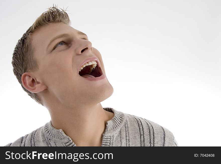Laughing young man against white background