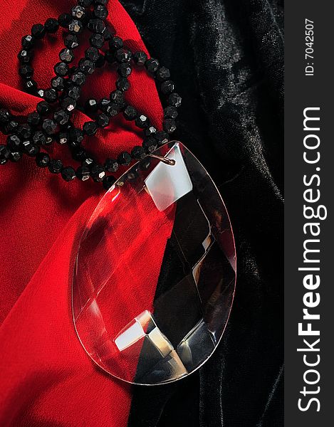 Glass ornament against a red and black velvet. Glass ornament against a red and black velvet