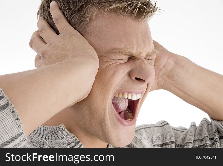 Screaming young man on an isolated white background