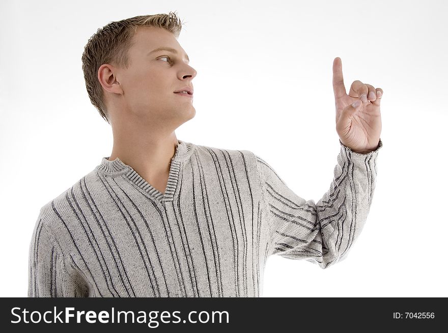 Young man looking at his finger with white background