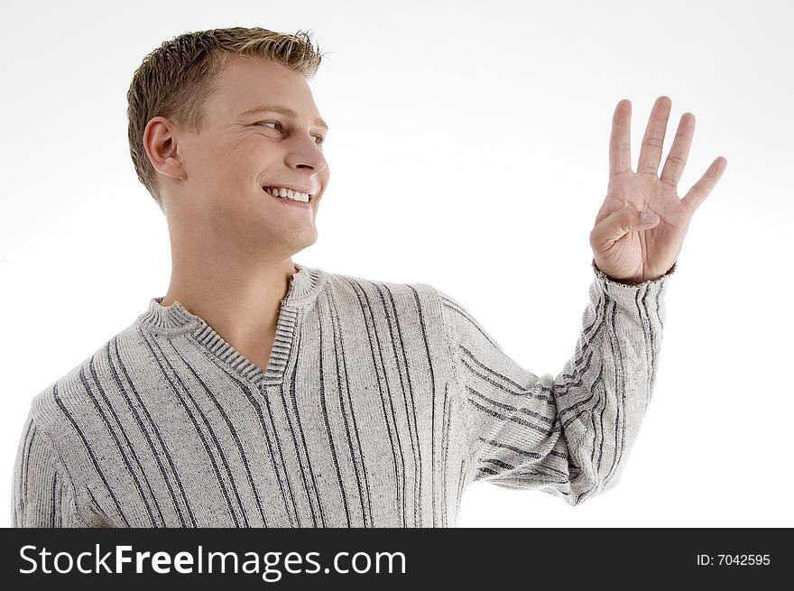 Smiling man with counting hand gesture