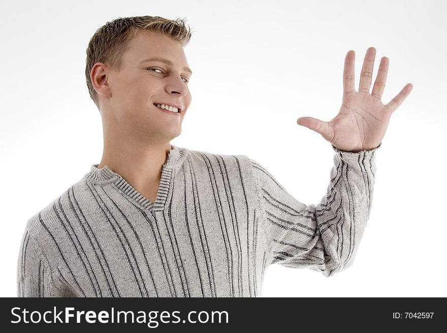 Young man with counting hand gesture