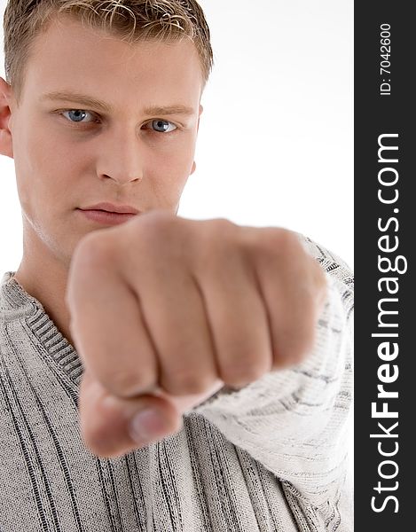 Smiling man showing punch against white background