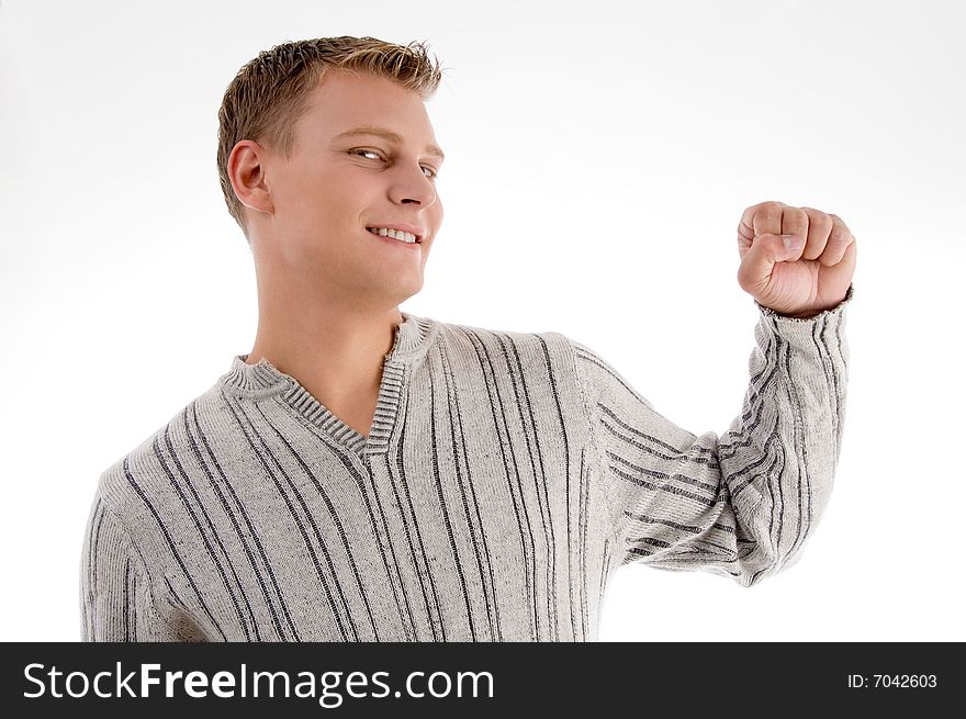 Smiling man showing his fist with white background