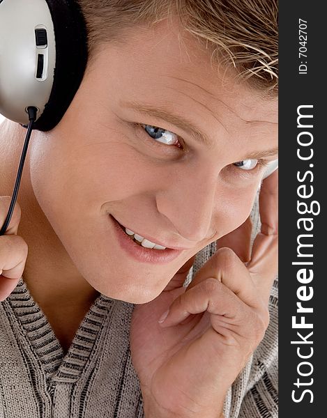 Smiling man with headphone on an isolated background