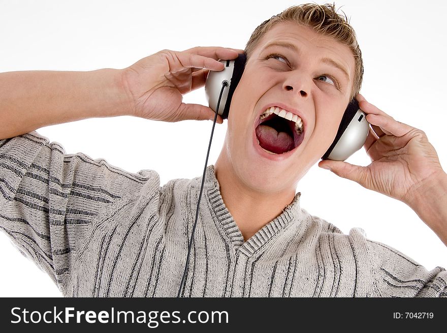 Shouting man with headphone looking upward on an isolated background