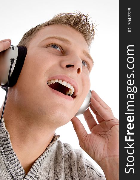 Young man with headphone on an isolated background