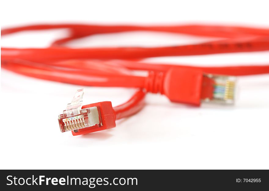 Red computer network cable on white background