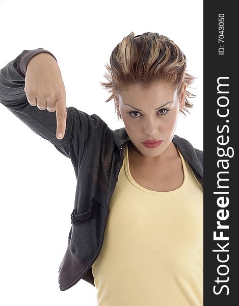 Young female pointing down on an isolated background