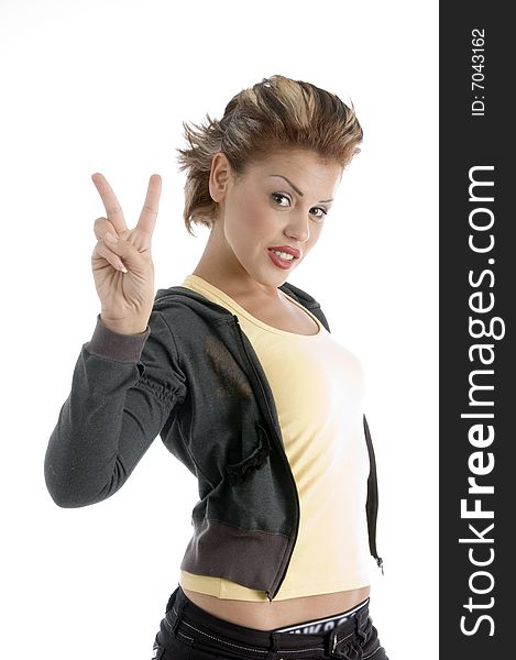Young woman showing winning gesture on an isolated background