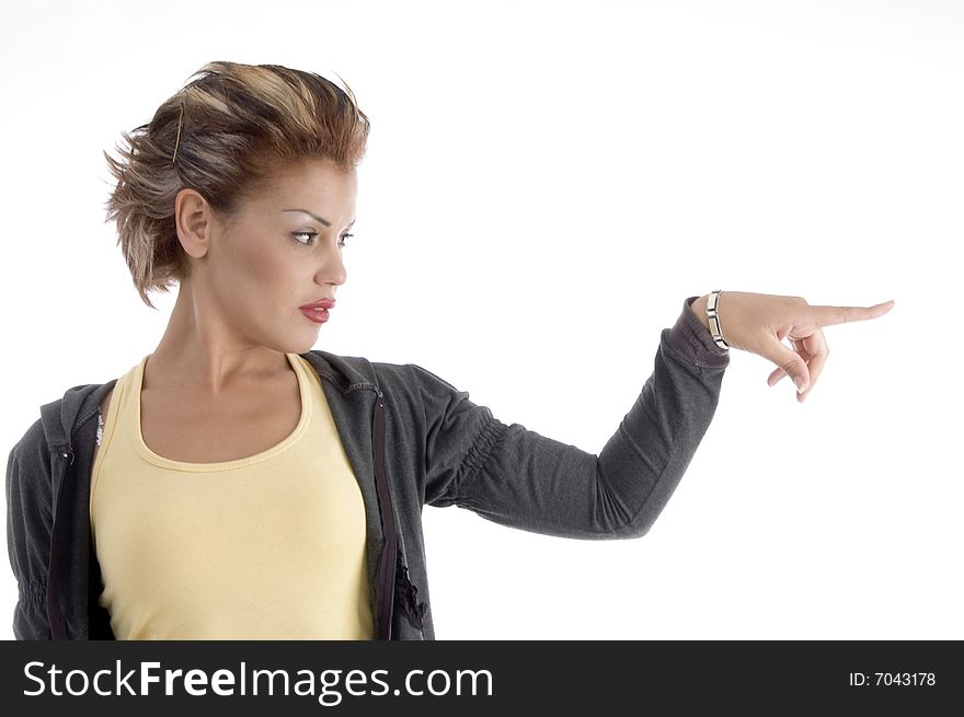 Attractive woman indicating side against white background