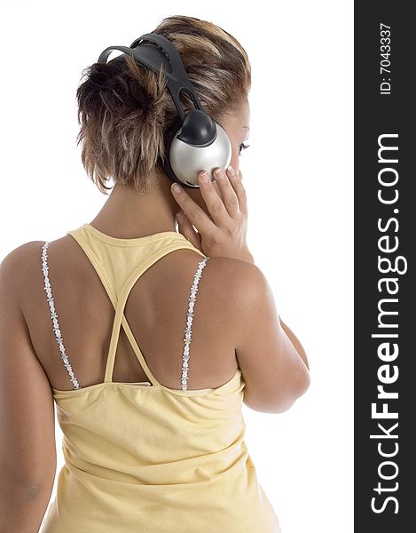 Back pose of female with headphone on an isolated background