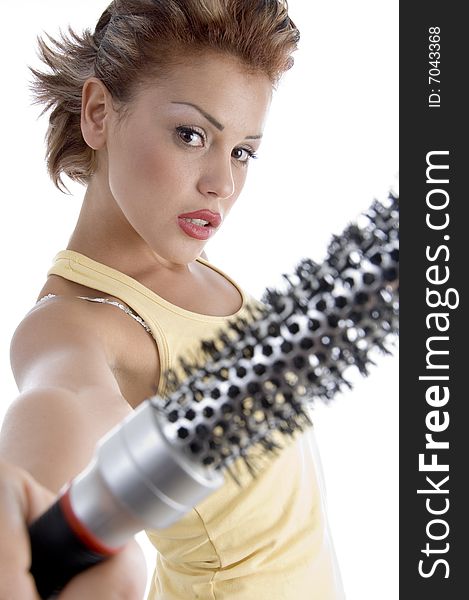 Woman posing with roller comb on an isolated background