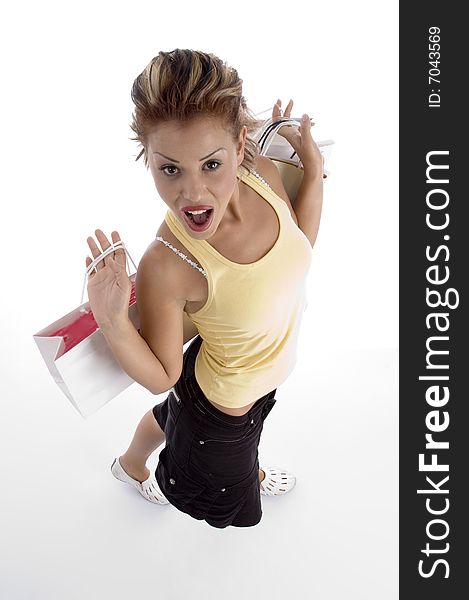 High angle view of sexy woman with shopping bag on an isolated background