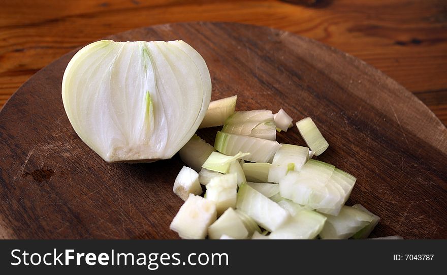 Onion On Wooden Cutting Board. Onion On Wooden Cutting Board
