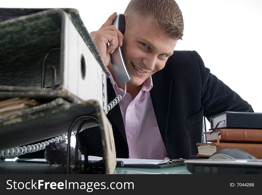 Handsome smiling manager busy on phone on an isolated white background. Handsome smiling manager busy on phone on an isolated white background