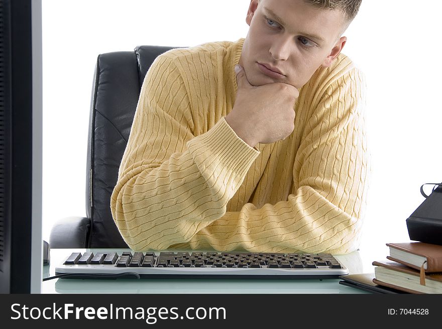 Thinking male while looking on screen on an isolated white background