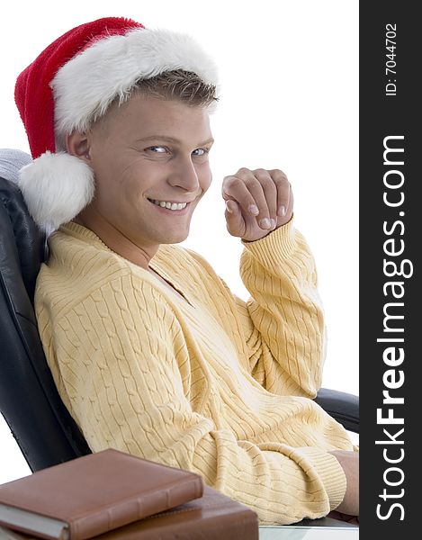 Handsome male wearing santa hat looking at camera with white background