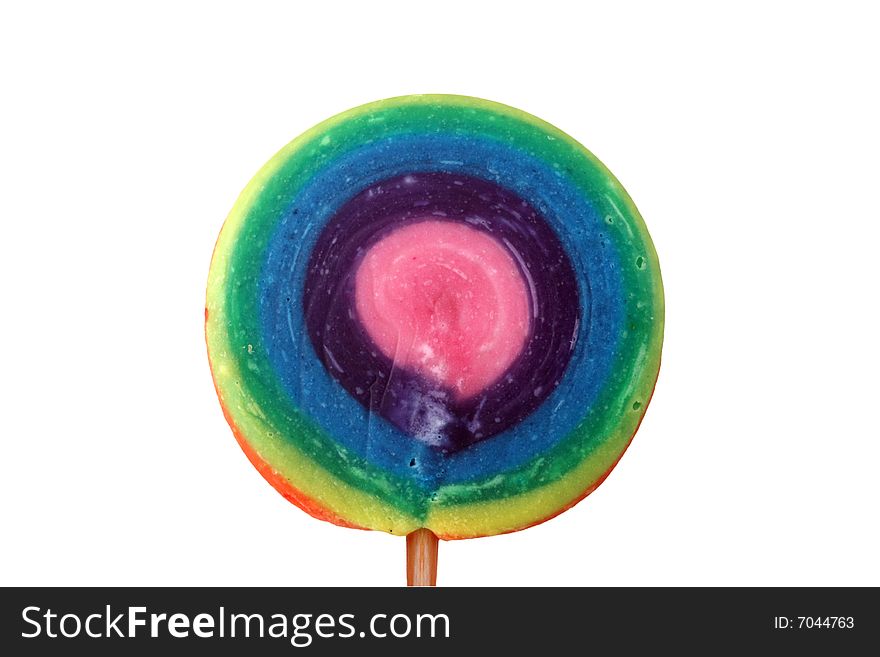 A brightly colored all-day lollipop on a wooden stick, isolated on a white background.