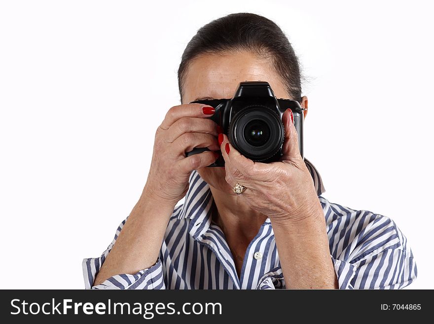 Woman with fotocamera takes a photo isolated over white. Woman with fotocamera takes a photo isolated over white