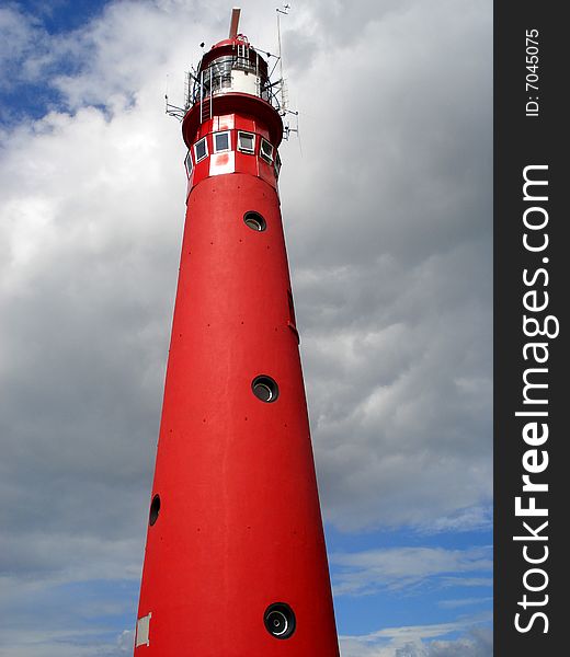 Red lighthouse and blue sky