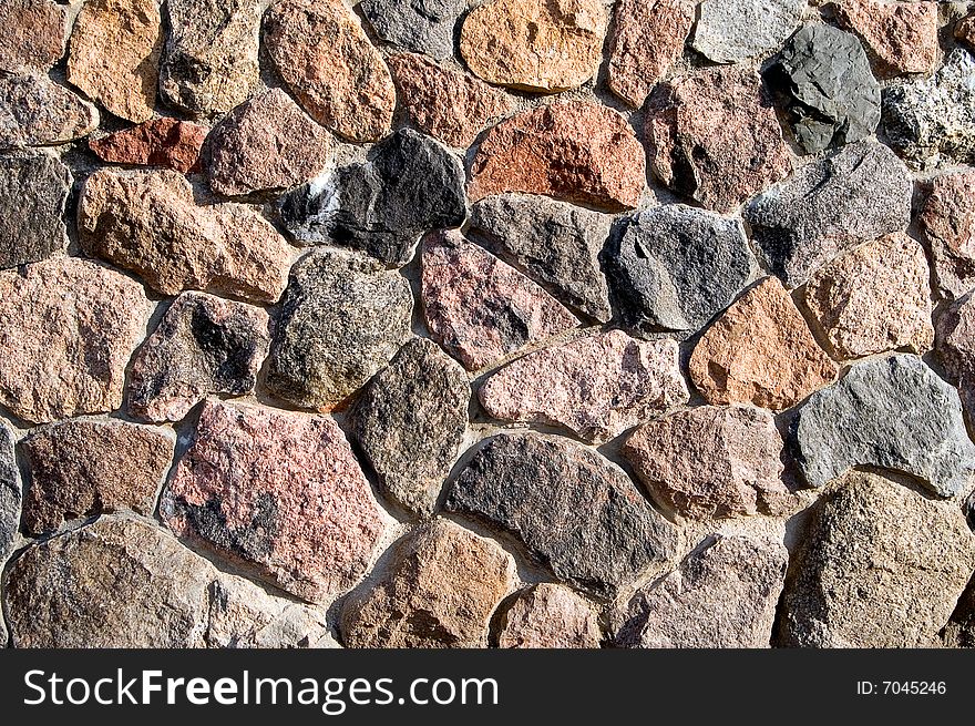 Brown stone wall of natural stones. Brown stone wall of natural stones