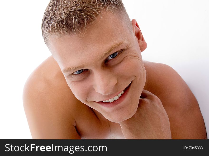 Close up of smiling muscular man with white background