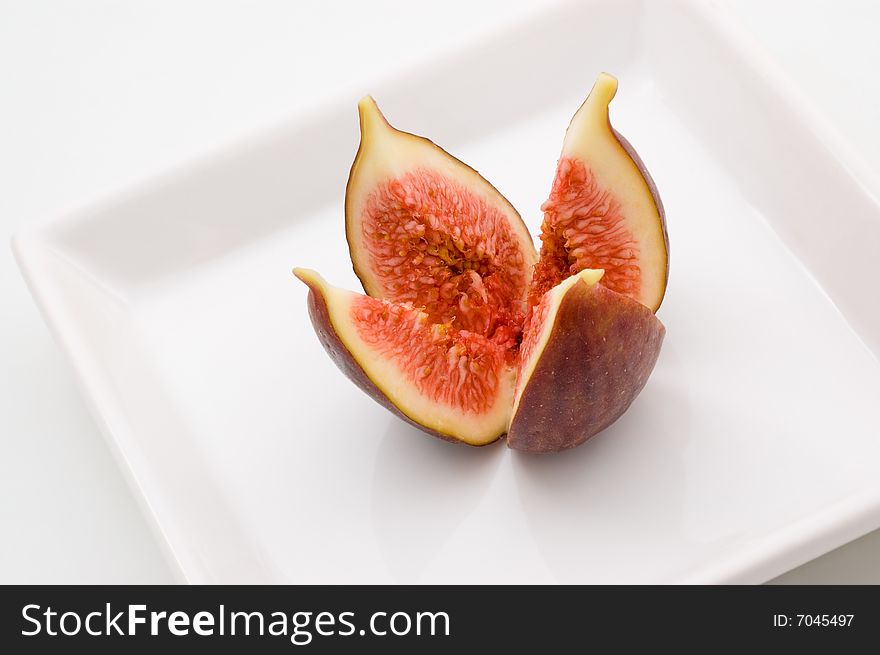 Fresh fig fruit on white plate