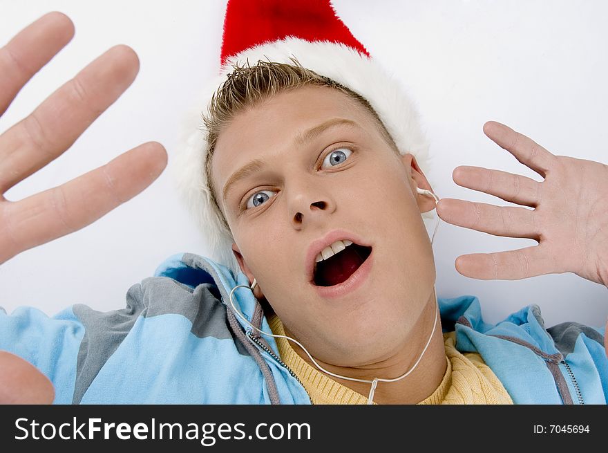 Scared young man with christmas hat on an isolated white background