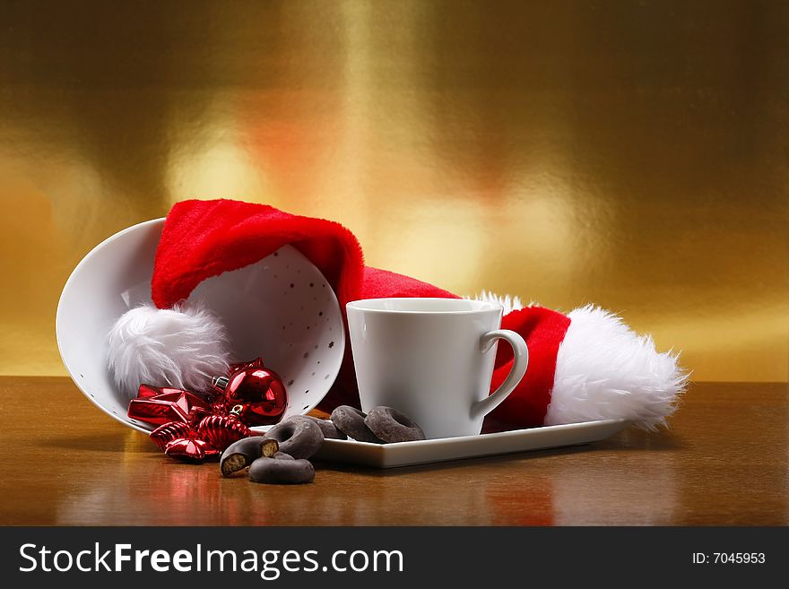 Milk and cookies for santa on table with gold background