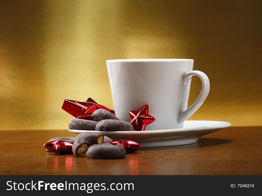 Milk and cookies for santa on table with gold background