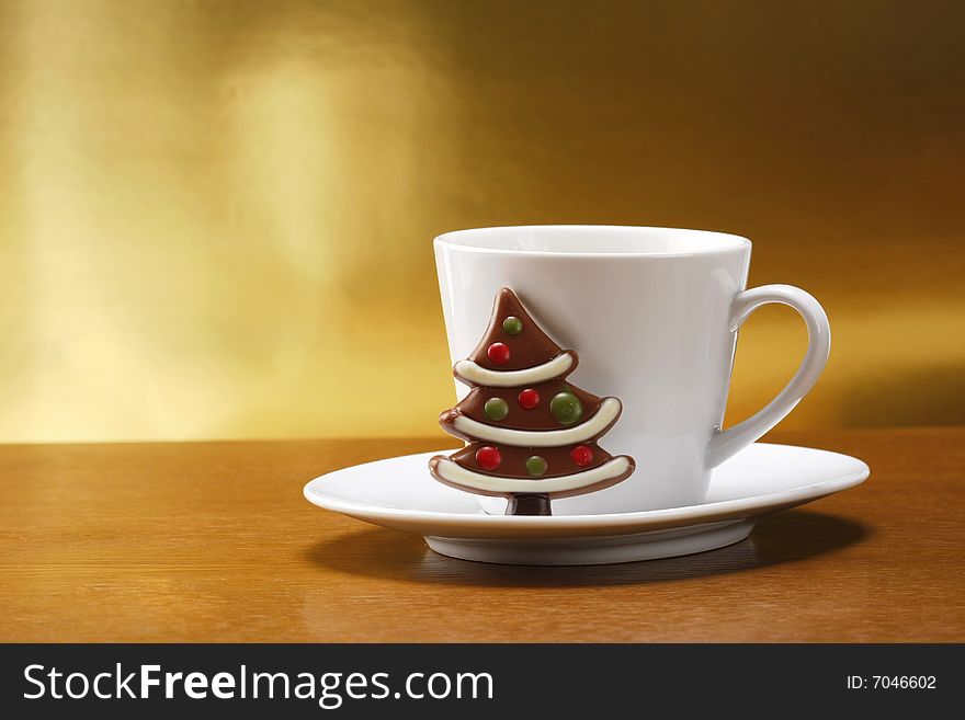 Milk and cookies for santa on table with gold background