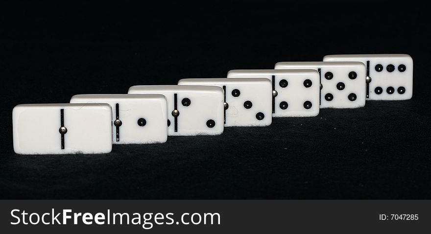 Seven dominoes arranged in a line. Seven dominoes arranged in a line