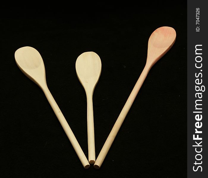 Three wooden spoons on a table