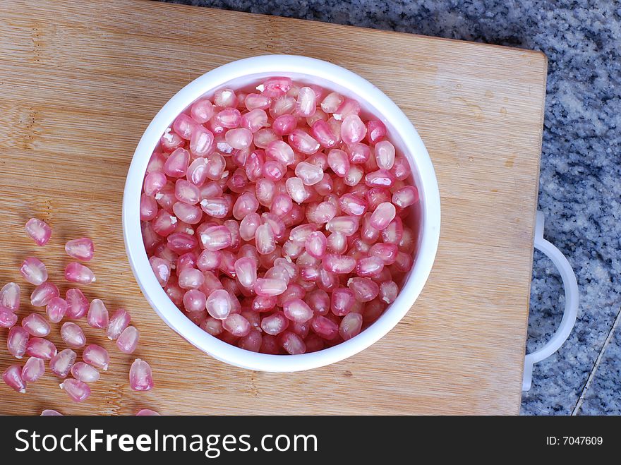 Red pomegranate in the bowl