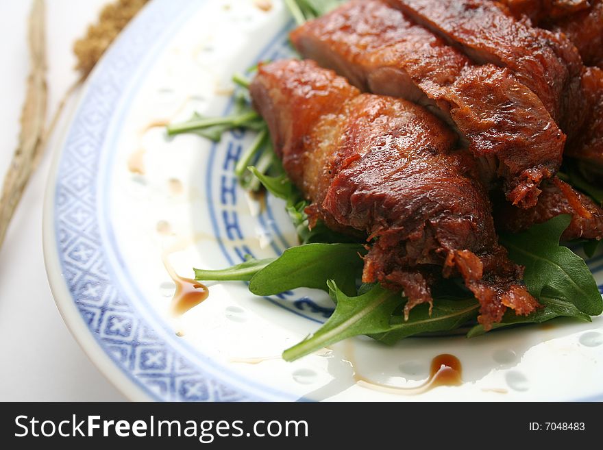 A meal of a chinese duck with salad