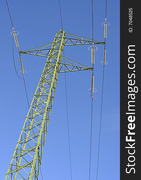 Green electricity pylon on a clear blue sky. Green electricity pylon on a clear blue sky