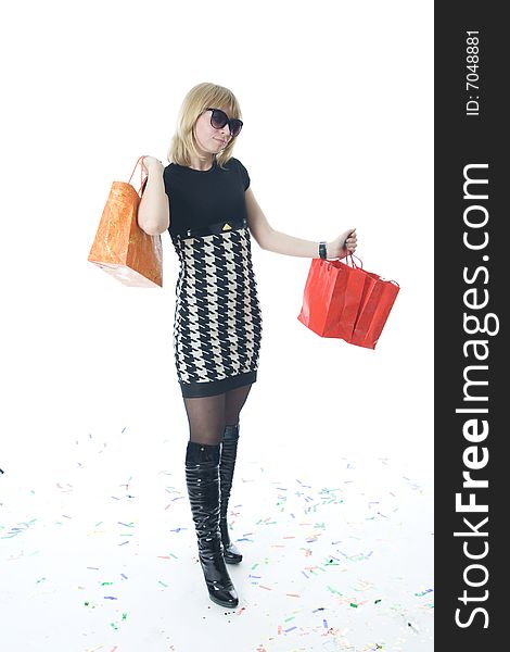 The young beautiful girl with packages isolated on a white background