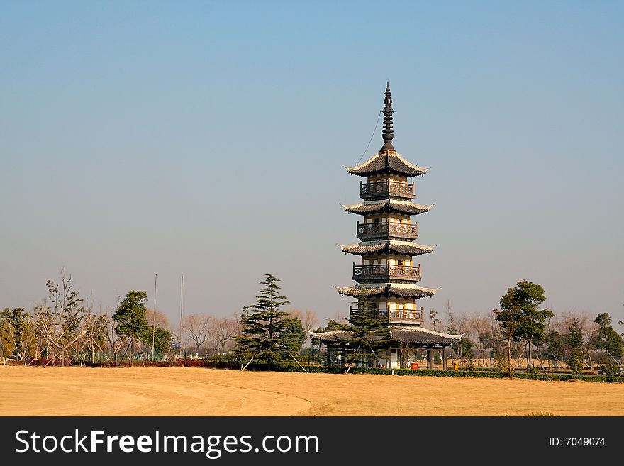 Chinese tower with grassland in autumnl