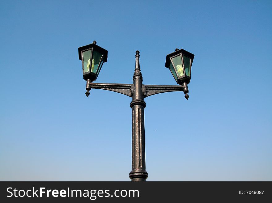 Old lamp with blue sky