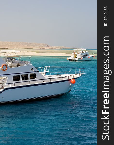 Yachts by an island in the Red Sea. Yachts by an island in the Red Sea